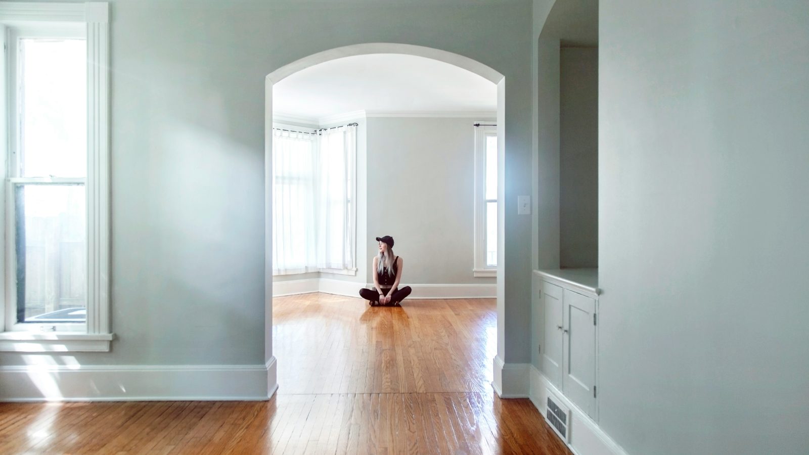 brown short coated dog on brown wooden parquet floor